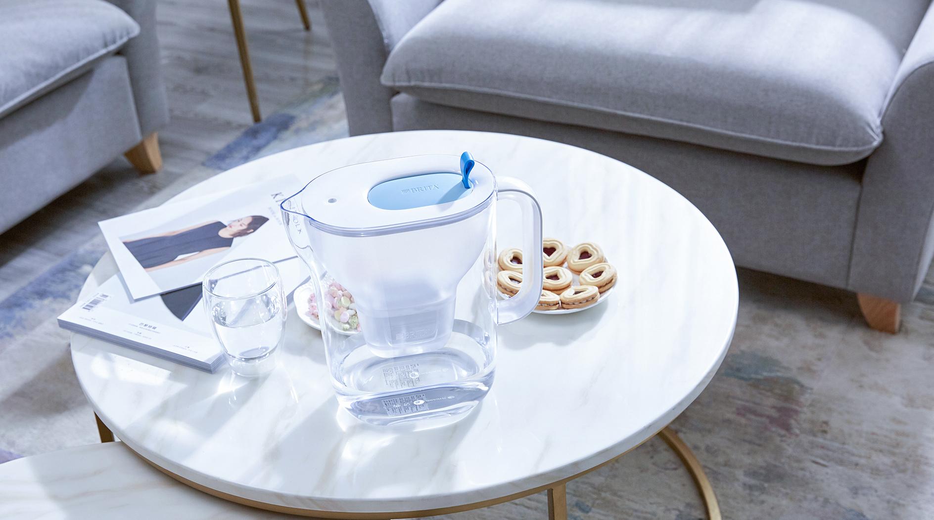 BRITA hydration needs woman couch drinking water